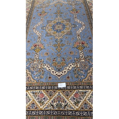 "Sky-blue Persian rug with intricate floral and medallion design, hand-knotted by Mansourie, 220 x 150 cm."
