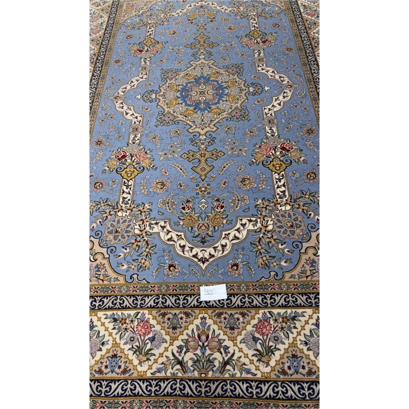"Sky-blue Persian rug with intricate floral and medallion design, hand-knotted by Mansourie, 220 x 150 cm."
