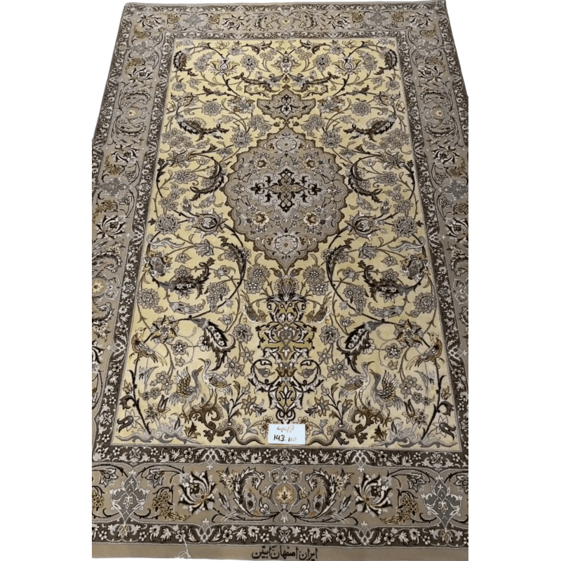 "Hand-knotted Persian rug made from wool and silk, showcasing traditional Isfahan design. Size: 143 cm x 110 cm. Knot density of 810,000 knots/m². Perfect for adding elegance to any living space."