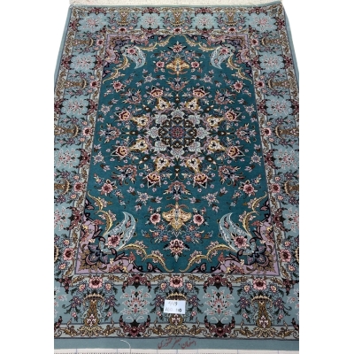 Hand-knotted Isfahan Persian rug with teal background and floral medallion.
