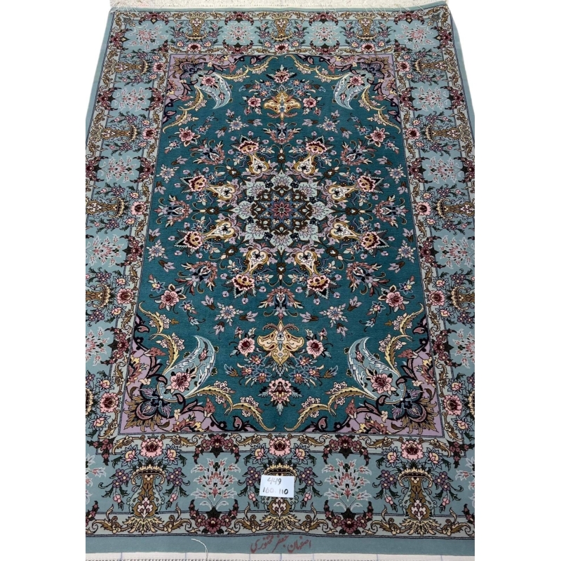 Hand-knotted Isfahan Persian rug with teal background and floral medallion.