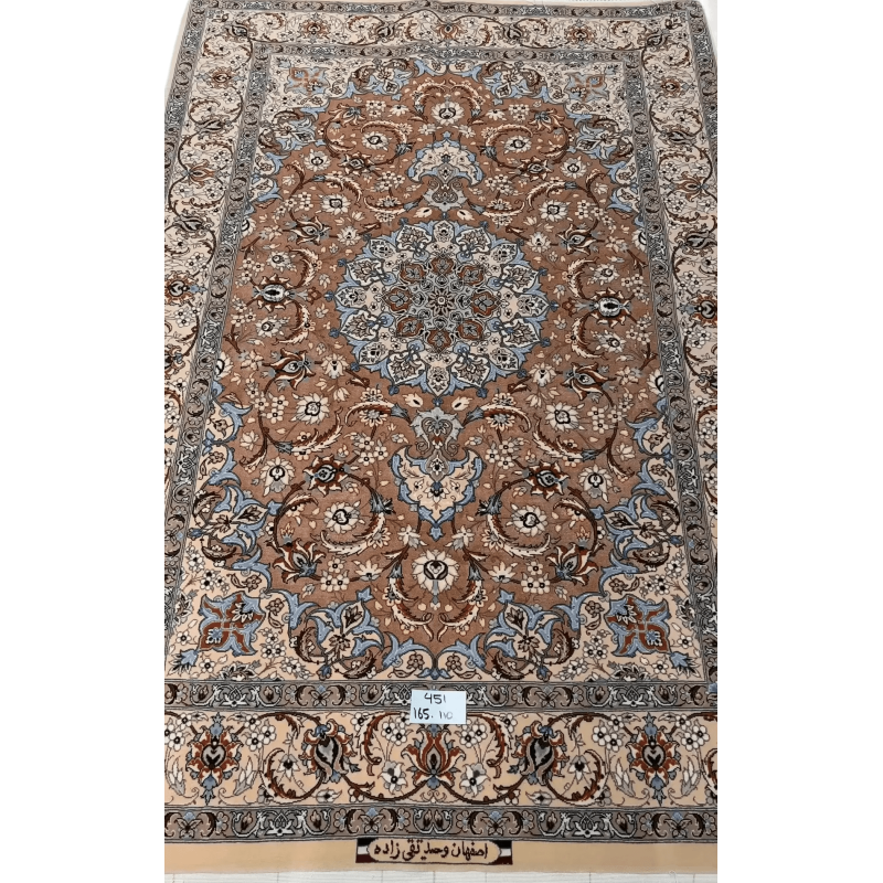 "Elegant Persian Isfahan rug handcrafted from wool and silk, measuring 165 cm x 110 cm. Features detailed traditional patterns, perfect as a luxurious area rug. Made in Isfahan, Iran, by master weaver Taghie Zadeh."