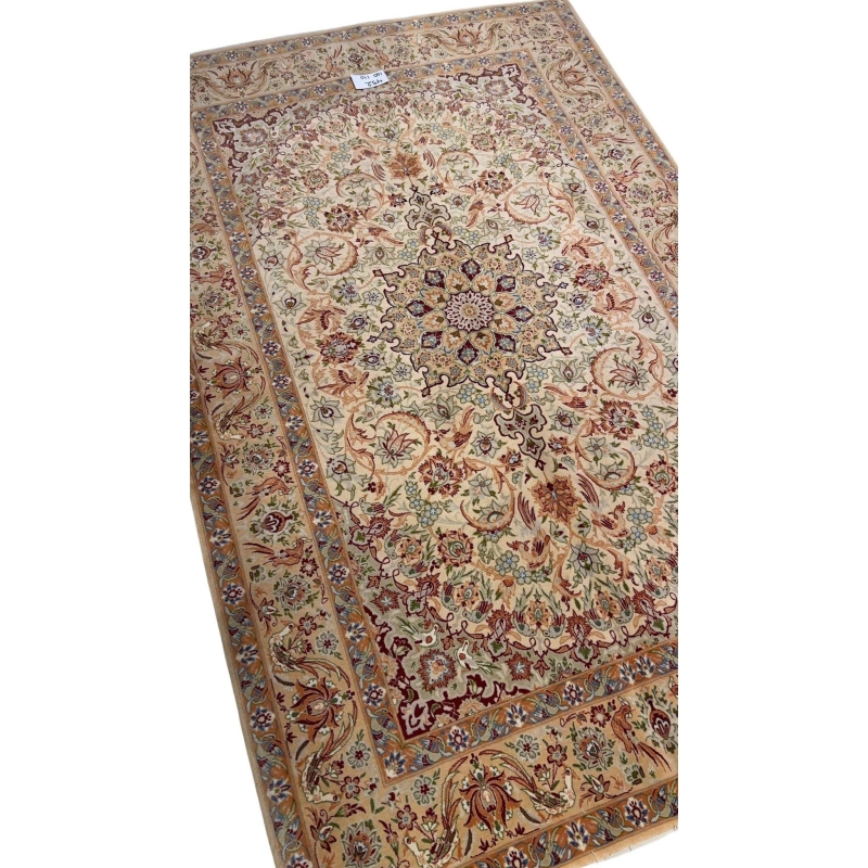 "60-year-old Persian rug featuring detailed silk and wool craftsmanship."