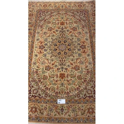 "Handmade vintage Persian rug with intricate floral design from Isfahan, Iran."
