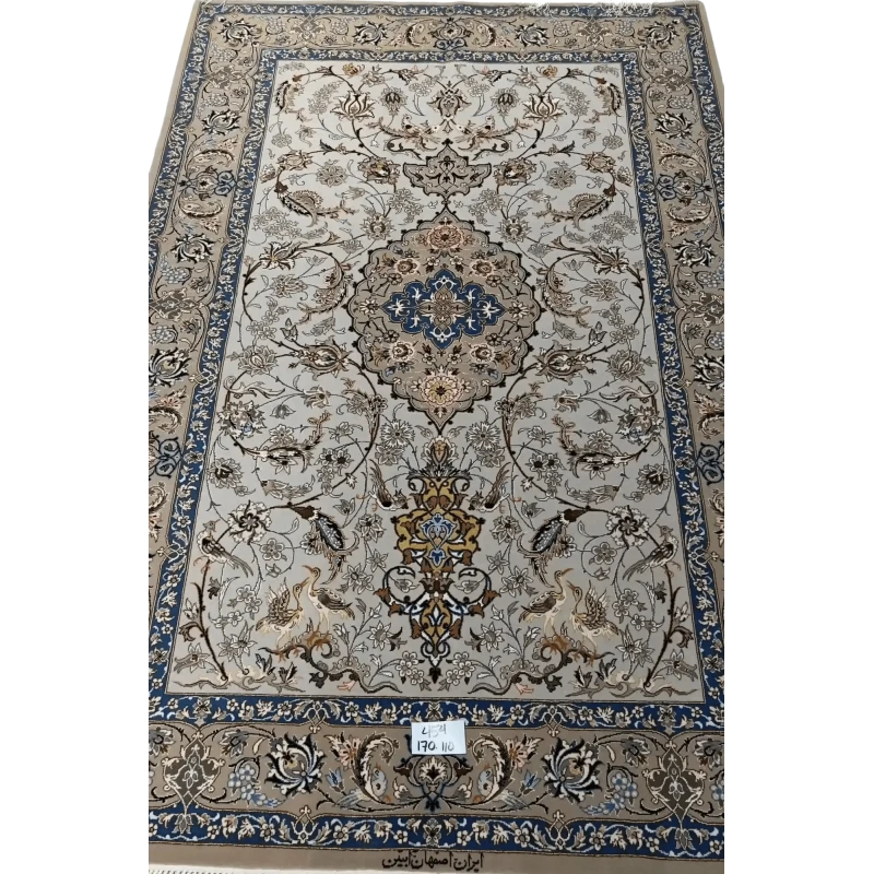 "Light grey Persian Isfahan rug, handcrafted using wool and silk. Elegant designer area rug with intricate details, measuring 170 cm x 110 cm. High knot density for added comfort and beauty."