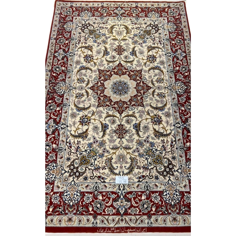 "Hand-knotted Isfahan rug featuring floral designs, crafted with wool and silk."