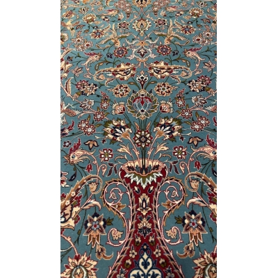 "Light blue Persian rug, 170x110 cm, handmade in Isfahan by Master Zojajie, featuring intricate floral designs and crafted from silk and wool."