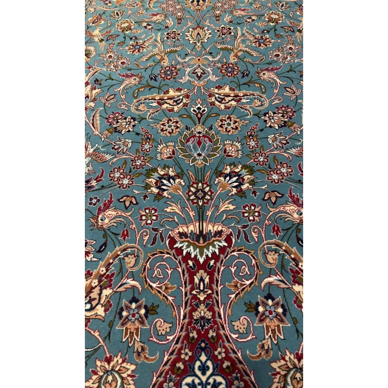 "Light blue Persian rug, 170x110 cm, handmade in Isfahan by Master Zojajie, featuring intricate floral designs and crafted from silk and wool."