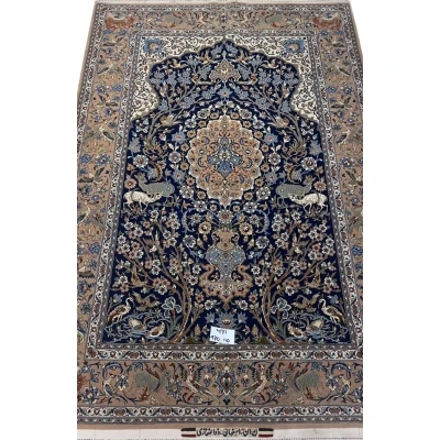 Close-up view of the fine craftsmanship on the Limited Edition Persian Rug with blue and brown motifs