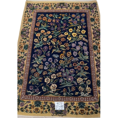 Persian Isfahan floral rug with vibrant pansy and butterfly design.
