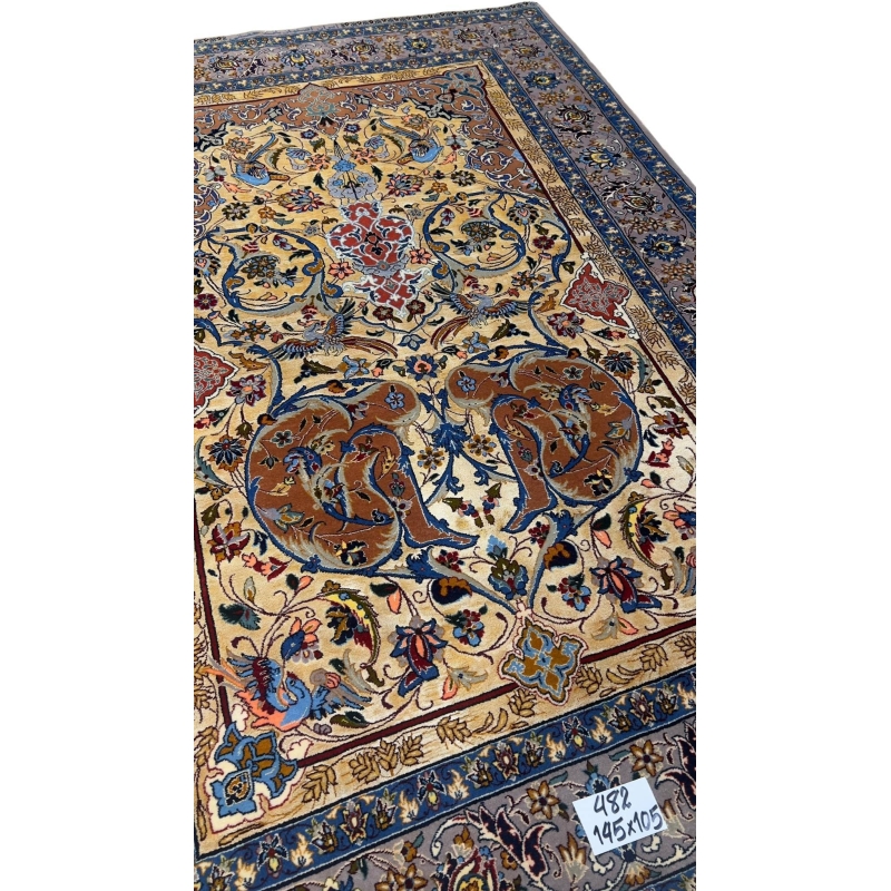 Hand-knotted Persian Isfahan rug with bird and floral motifs.