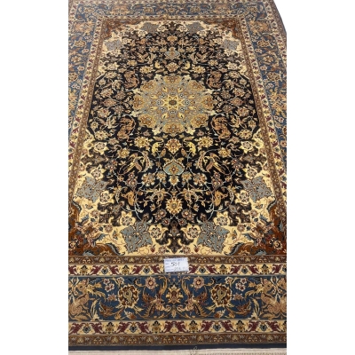 Hand-knotted Persian wool and silk rug from Isfahan, 60 years old and in excellent condition.