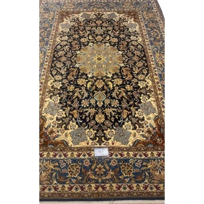 Hand-knotted Persian wool and silk rug from Isfahan, 60 years old and in excellent condition.