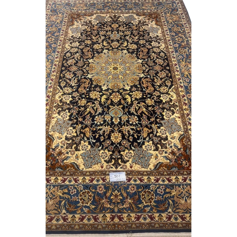 Hand-knotted Persian wool and silk rug from Isfahan, 60 years old and in excellent condition.