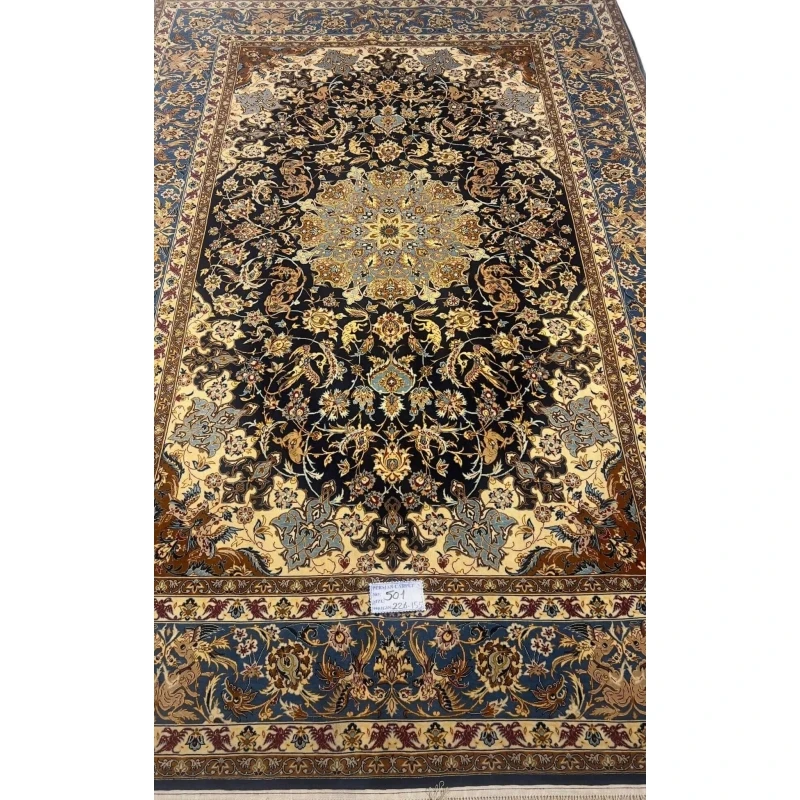 Hand-knotted Persian wool and silk rug from Isfahan, 60 years old and in excellent condition.