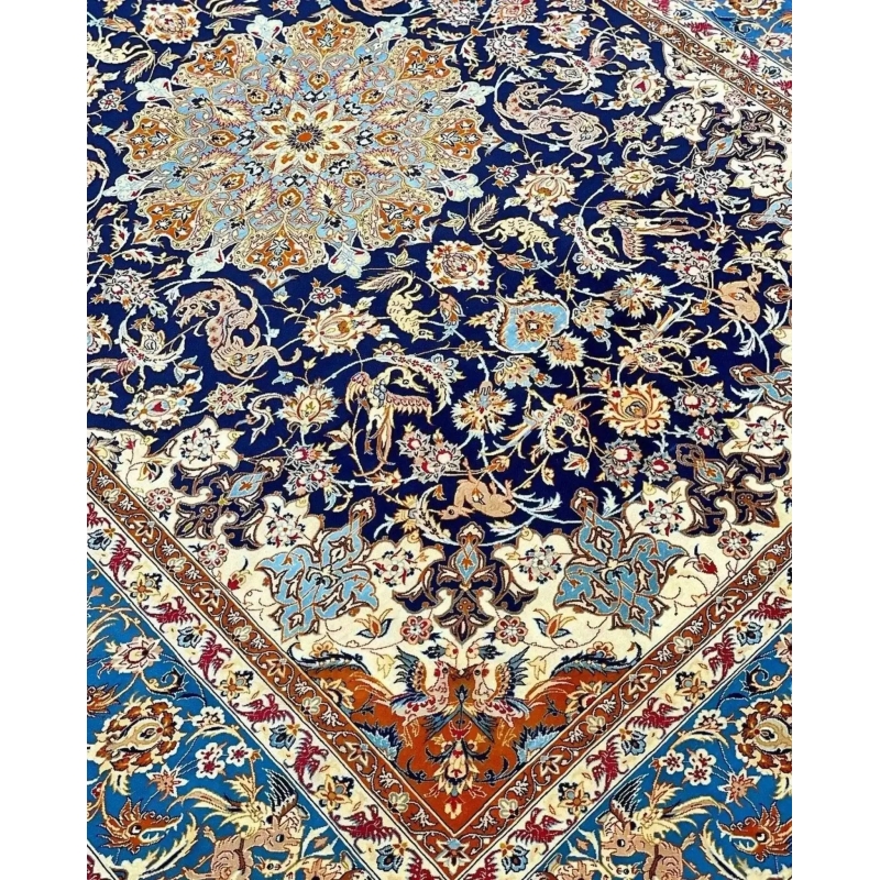 "Vintage Isfahan Persian rug with golden medallion on black background, hand-knotted in Iran."