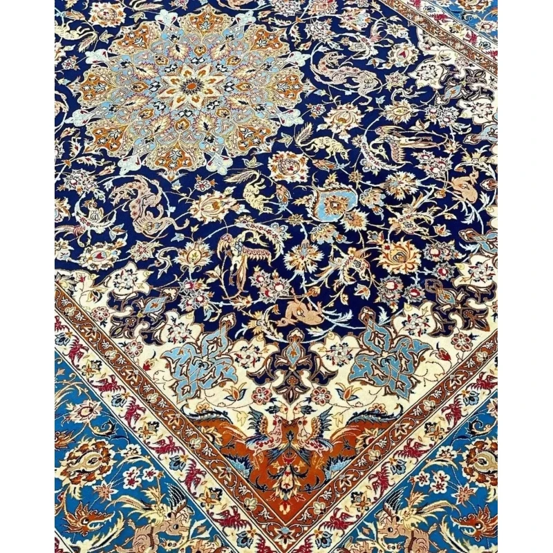 "Vintage Isfahan Persian rug with golden medallion on black background, hand-knotted in Iran."