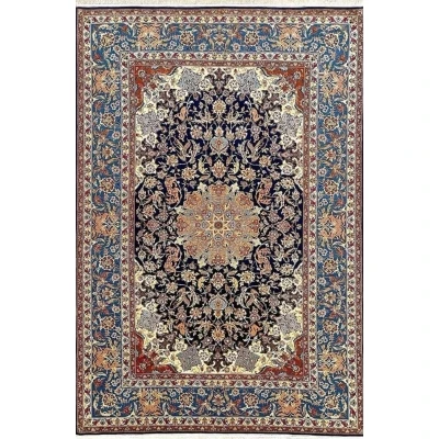 Vintage Persian rug handmade in Isfahan, featuring a traditional medallion design.
