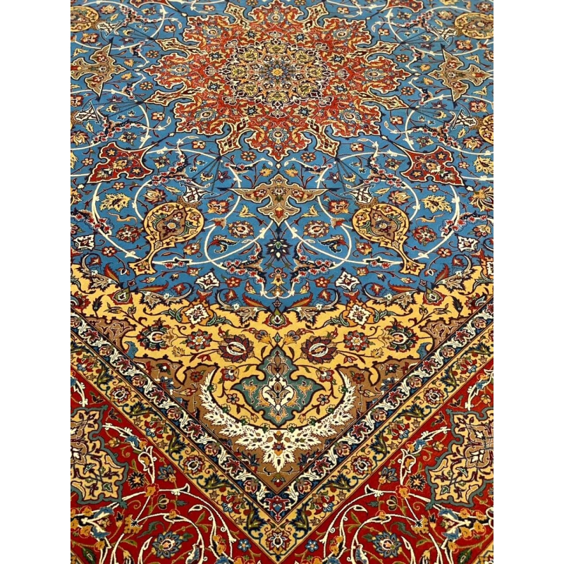 "Red and blue Persian rug from Isfahan, hand-knotted with wool and silk blend."