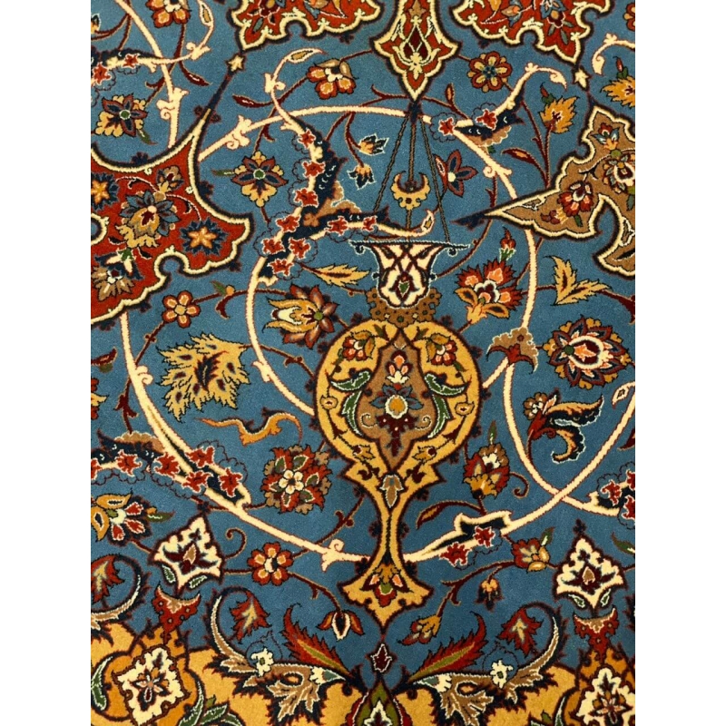 "Backside view of red and blue Persian rug, showing hand-knotted craftsmanship by Ahmad Shabpour."