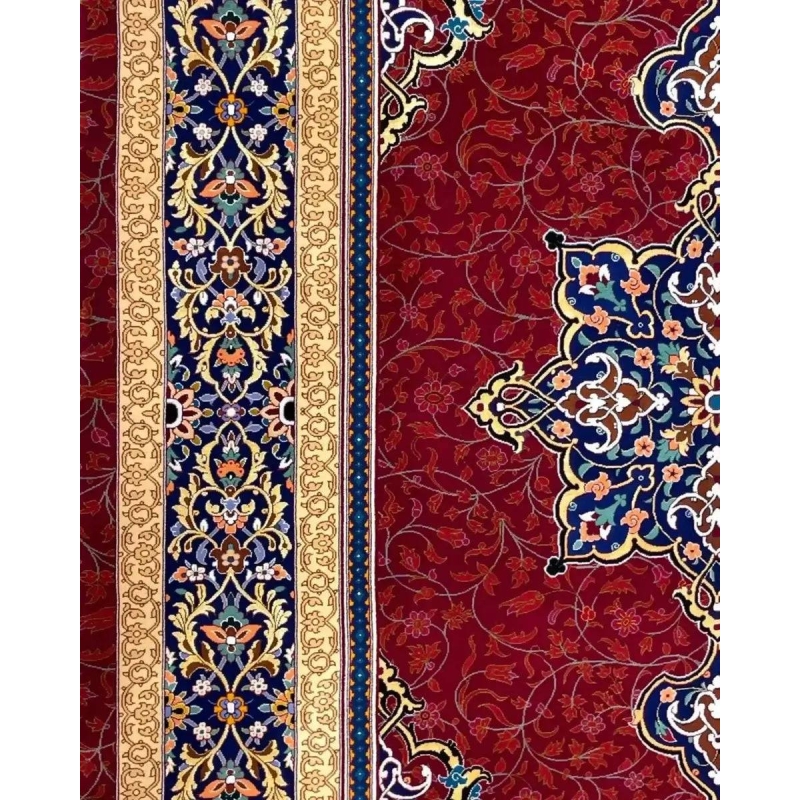 Handmade Persian Rug from Isfahan, Iran - An angled shot of a Persian rug displaying the rich red background with golden floral patterns and a complex blue medallion in the center.