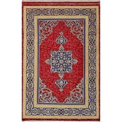 Persian Area Rug by Ali Reza Haghighie - Top view of an intricate handmade Persian rug featuring a central medallion design, woven with wool and silk in rich red, navy, and gold hues.

