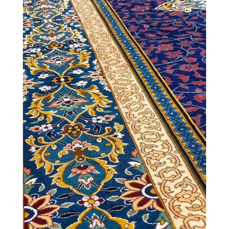 Traditional Persian Rug from Isfahan - A detailed shot of the central medallion and surrounding floral patterns, emphasizing the rug's intricate design and vibrant color palette.