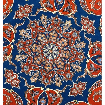 Persian circular rug with intricate floral patterns and a luxurious blend of wool and silk.