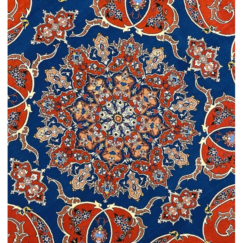 Persian circular rug with intricate floral patterns and a luxurious blend of wool and silk.