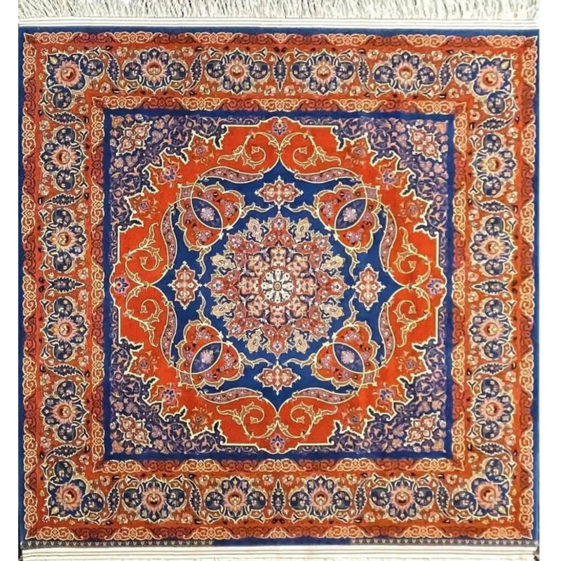 Round Isfahan rug featuring a medallion design in vibrant orange and royal blue, handcrafted by Master Nasrollah Haghighie.