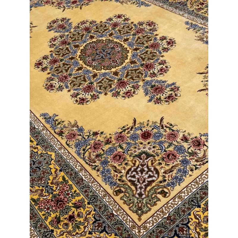 Artisanal silk carpet adorned with traditional floral motifs