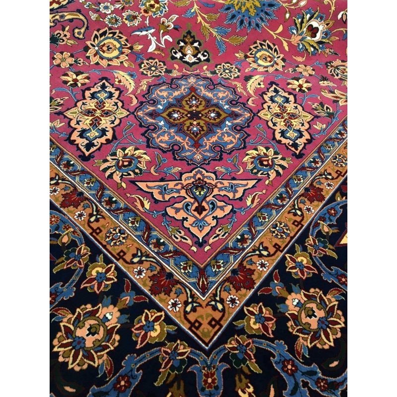 Side angle of the purple and grey oriental rug, highlighting the intricate knot work and delicate floral details.