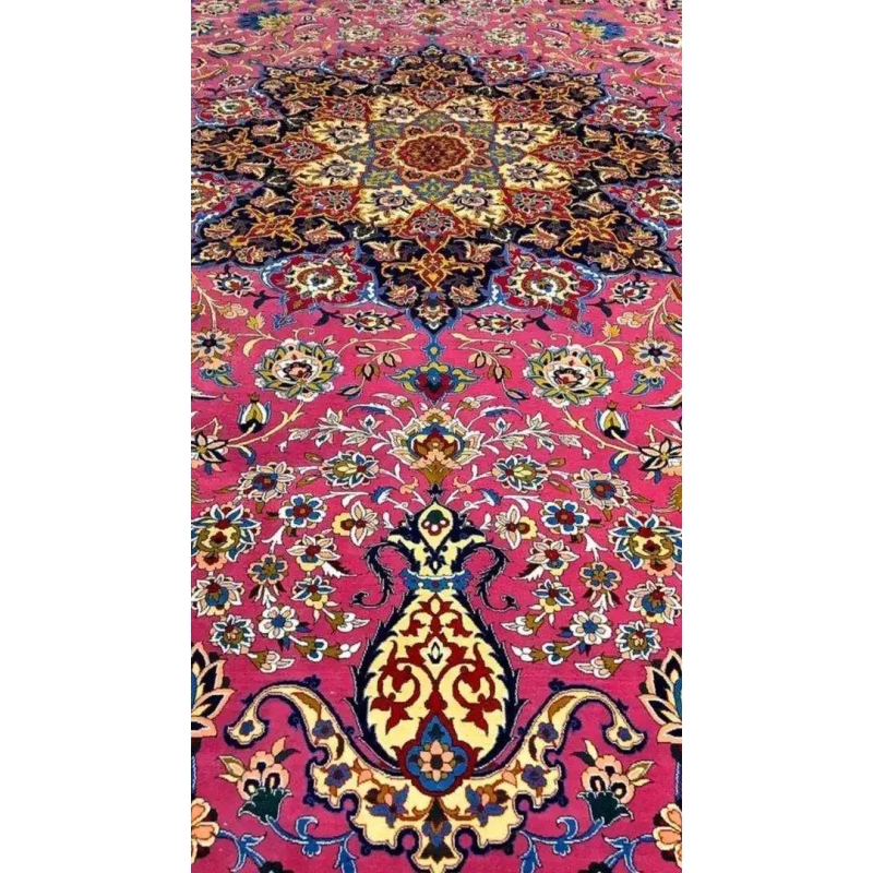 Detailed corner view of the purple oriental rug, showcasing a vibrant mix of colors and intricate floral designs against a purple background.