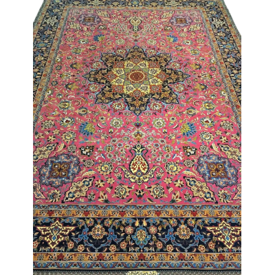 Hand-knotted purple oriental rug with intricate floral patterns, highlighting a vibrant medallion in the center, surrounded by a decorative border.