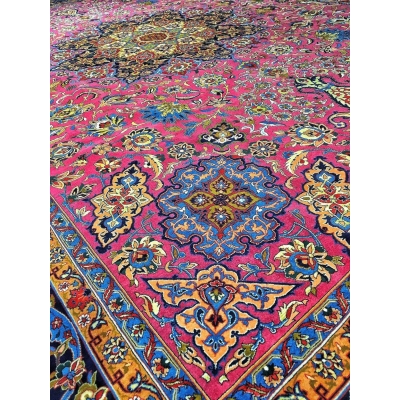 Purple hand-knotted wool rug with a central medallion and ornate border, perfect for adding a touch of elegance to any room.