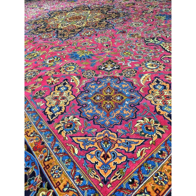 Purple hand-knotted wool rug with a central medallion and ornate border, perfect for adding a touch of elegance to any room.