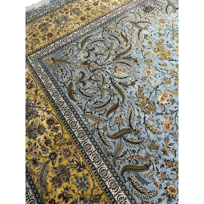 "Elegant hand-knotted Persian rug with a beautiful mix of blue and yellow hues, highlighting traditional motifs from Iranian carpet-making heritage."