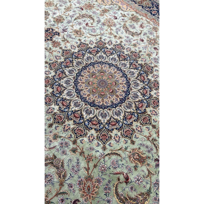 "Close-up of intricate knotwork on Persian silk rug, featuring a light green silk field."