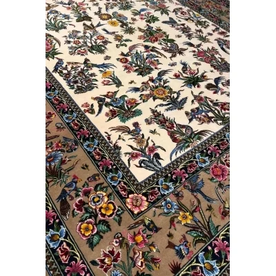 Mansourie's Legacy Persian carpet adorned with intricate floral and avian motifs