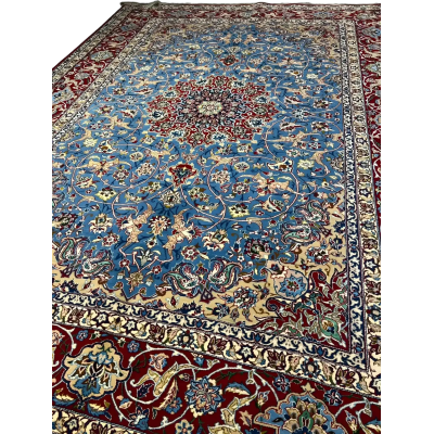 Close-up view of the intricate patterns on the Authentic Isfahan Rug with blue and red hues