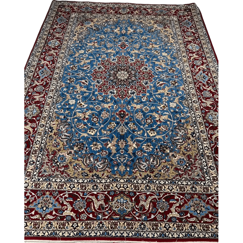 Detail shot of the hand-knotted craftsmanship of the Authentic Isfahan Rug with a focus on the blue and red design