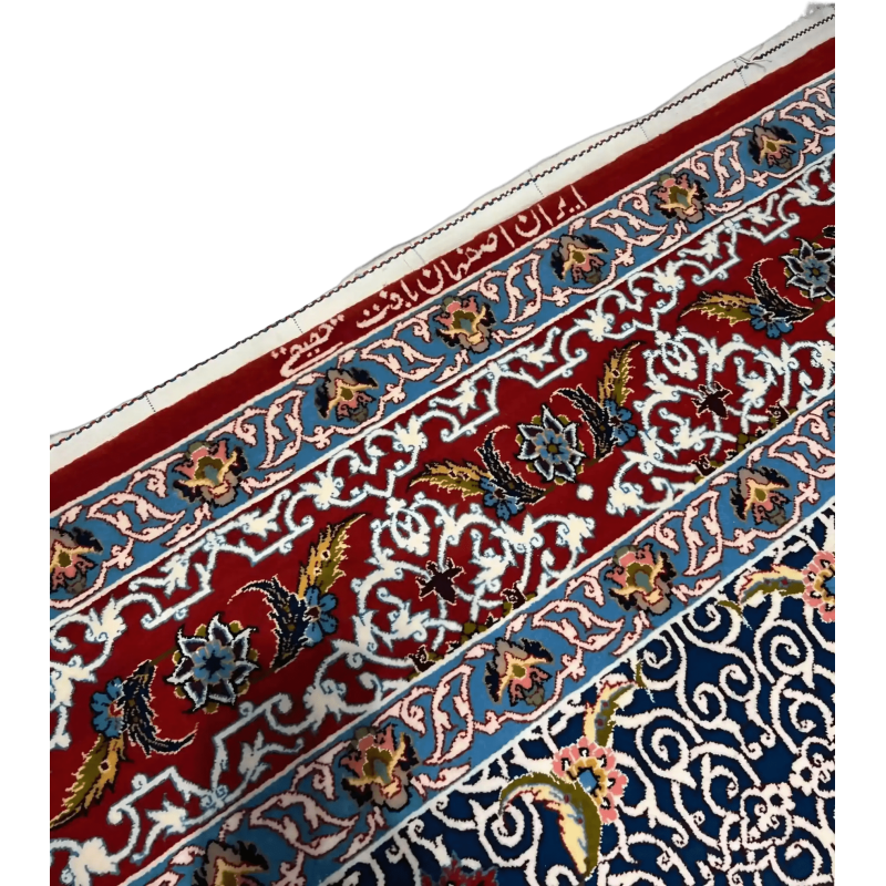 Detailed view of a Haghighie rug featuring red and blue traditional motifs