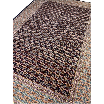 Hand-knotted Persian rug with intricate pattern, wool and silk blend