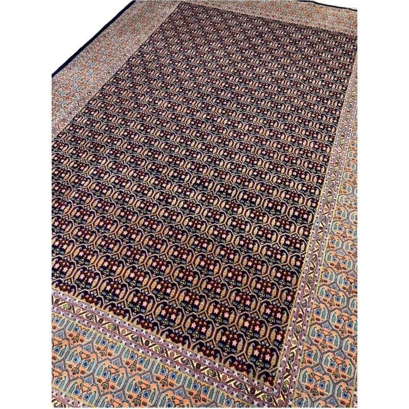 Hand-knotted Persian rug with intricate pattern, wool and silk blend
