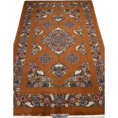 Hand-knotted Isfahan rug featuring a Kazak-inspired geometric design and floral border.