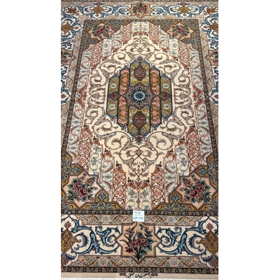 "Luxury Persian carpet in ivory, gold, and deep blue, featuring delicate arabesque patterns and floral motifs."