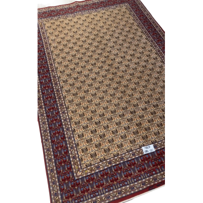 "Hand-knotted Isfahan rug with geometric designs, wool and silk pile"