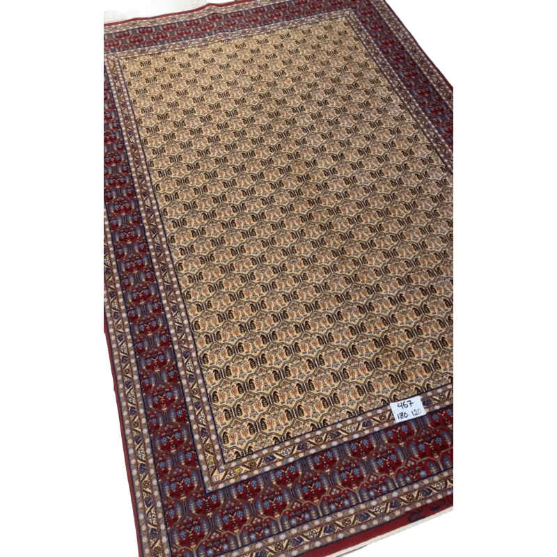 "Hand-knotted Isfahan rug with geometric designs, wool and silk pile"