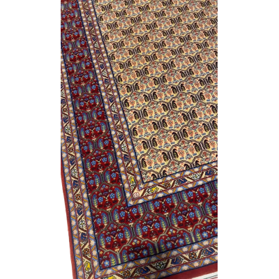 "Antique Persian rug with vegetable dyes and intricate patterns"