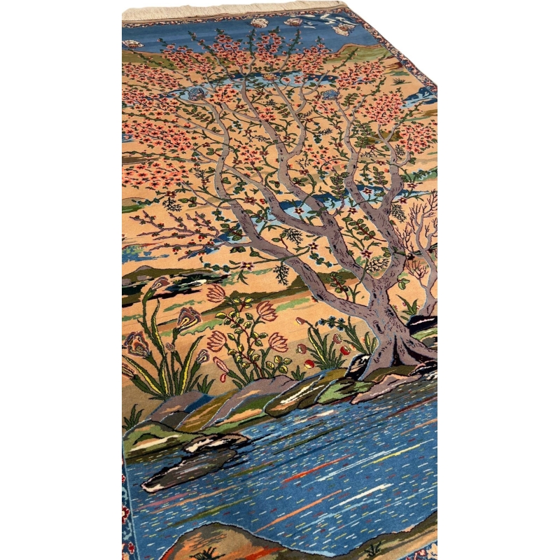 "Artisan-crafted Persian rug with vibrant tree and floral patterns in natural dyes."